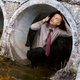 Illustration for article titled Undecided Voter Silently Crouching Inside Drain Pipe As Convoy Of Political Analysts Passes Overhead